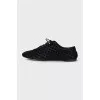 Black suede shoes with branded embossing