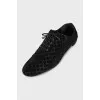 Black suede shoes with branded embossing