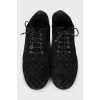 Black suede shoes with branded embossing