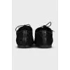 Black suede shoes with branded embossing