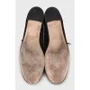 Black suede shoes with branded embossing