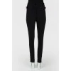 Pants fitting with red stripes with tag
