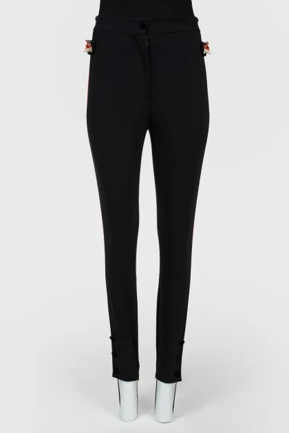 Pants fitting with red stripes with tag