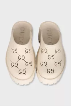 Beige clogs with logo