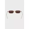 Gold sunglasses with logo on the lens