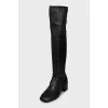 Black over-the-knee boots with leather tassels