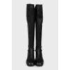 Black over-the-knee boots with leather tassels