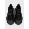 Black brogues with rubber toes