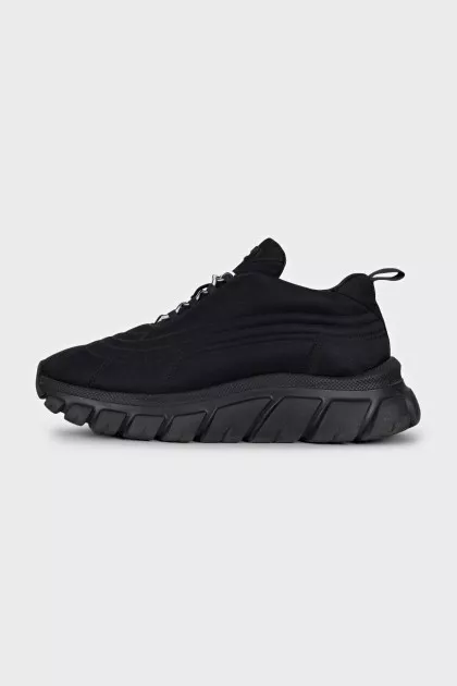 Black sneakers with a logo on a ribbed sole