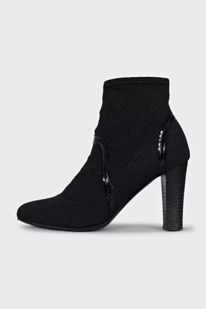 Ankle boots with perforated heels