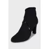 Ankle boots with perforated heels