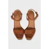 Suede sandals with a gold platform