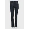 Blue jeans with metal jewelry