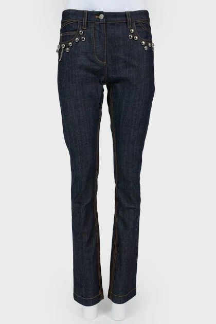 Blue jeans with metal jewelry
