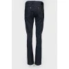 Blue jeans with metal jewelry