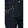 Blue jeans with metal jewelry