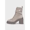 Gray lace-up boots with tag