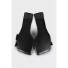 Black leather flip flops with a bow