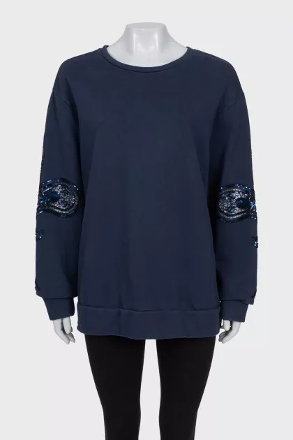 Sweatshirt with perforated sleeves