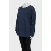 Sweatshirt with perforated sleeves