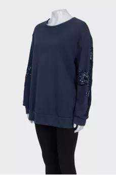 Sweatshirt with perforated sleeves