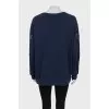Sweatshirt with perforated sleeves