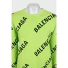 Green oversized jumper with a signature monogram