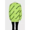 Green oversized jumper with a signature monogram
