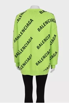 Green oversized jumper with a signature monogram