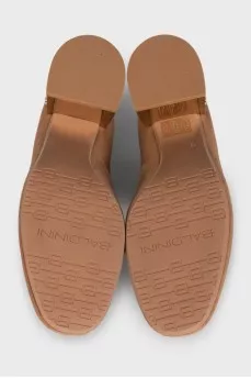 Suede shoes with a metallic heel