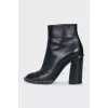 Black ankle boots with beaded embellishment