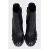 Black ankle boots with beaded embellishment