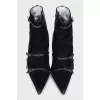 Suede ankle boots decorated with straps