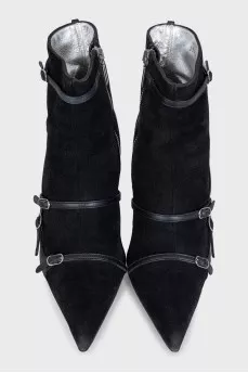 Suede ankle boots decorated with straps