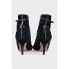 Suede ankle boots decorated with straps