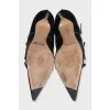 Suede ankle boots decorated with straps
