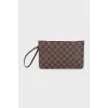 Clutch bag with a signature print and handle