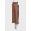 Wide-leg trousers with patch pockets and a belt