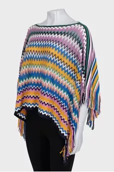 Multicolored cape with fringe
