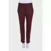 Burgundy trousers with creases