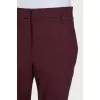 Burgundy trousers with creases