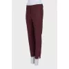 Burgundy trousers with creases
