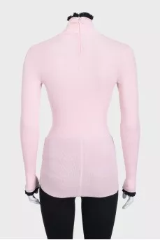 Pink zip-up turtleneck with accent cuffs