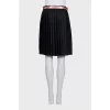 Black skirt with a pink belt