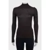 Brown jumper with a tie at the neck
