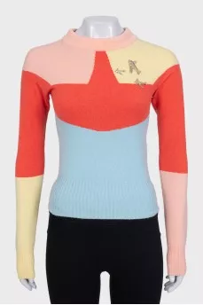 Multicolored jumper with airplanes