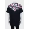 Straight black T-shirt with a floral print