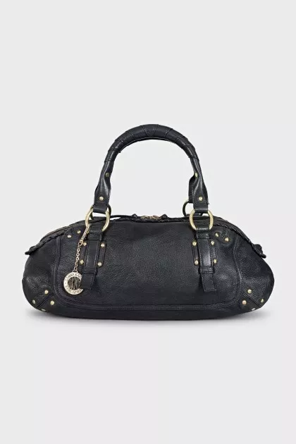 Leather bag decorated with rivets