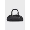 Leather bag decorated with rivets