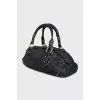 Leather bag decorated with rivets